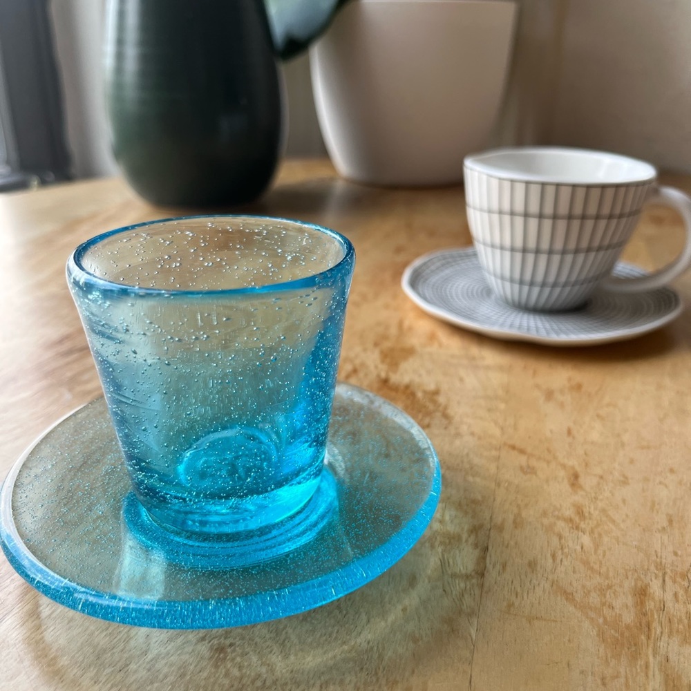 Two Italian espresso cups - one glass blown and one porcelain.